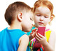 boy and girl playing with mobile