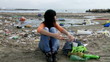 Video: Dolly shot on sad girl sitting on dirty beach crying Dolly shot on sad girl sitting on dirty beach crying