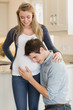 Man listening to stomach of pregnant woman