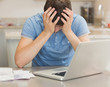 Photo: Depressed man worried about finances Depressed man worried about finances