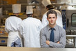 Photo: Waiter standing in the kitchen Waiter standing in the kitchen