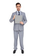 Serious businessman holding a clipboard