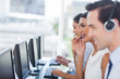 Foto: Focus of smiling call centre agent Focus of smiling call centre agent