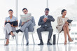 Photo: Waiting room with business people Waiting room with business people