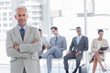 Serious businessman standing in a waiting room