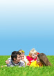 Portrait of happy family laying in field