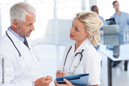 Photo: Two doctors speaking Two doctors speaking