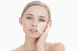 Photo: Pure woman touching her skin with close up of her wrinkles Pure woman touching her skin with close up of her wrinkles