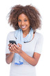 Smiling woman looking at camera and typing a text message