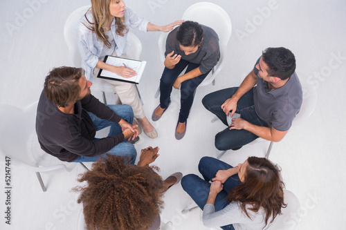 Photo: Therapist comforting her patient crying Therapist comforting her patient crying