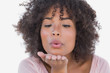 Photo: Happy woman blowing a kiss Happy woman blowing a kiss