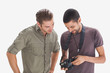 Friends looking at photo on camera