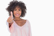 Woman giving thumbs up to camera
