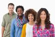 Photo: Fashionable friends standing in a row Fashionable friends standing in a row