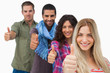 Friends giving thumbs up in a row