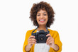 Photo: Happy girl holding a camera Happy girl holding a camera
