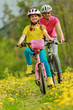 Photo: Bike riding - girl with mother on bike, active family concept Bike riding - girl with mother on bike, active family concept