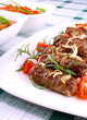 Grilled meat rolls with giant white beans and sauce