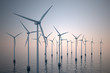 Floating wind turbines during hazy day.