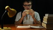 Happy nerd man counting money at night