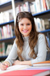 Young female student in a library