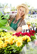 Photo: young blond girl with gardening tools young blond girl with gardening tools