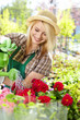 Photo: young blond girl with gardening tools young blond girl with gardening tools