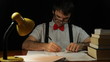 Nerd man working overtime in home office at night