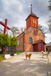 Photo: Small cottage church in the summer scenery, Poland Small cottage church in the summer scenery, Poland