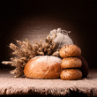 Bread, flour sack and ears bunch still life