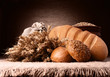 Bread, flour sack and ears bunch still life