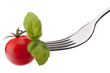 Foto: Basil leaf and cherry tomato on fork isolated on white backgrou Basil leaf and cherry tomato on fork isolated on white backgrou
