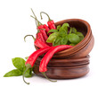 Photo: Hot red chili or chilli pepper in wooden bowls stack Hot red chili or chilli pepper in wooden bowls stack