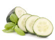 Sliced cucumber vegetable and basil leaves still life