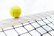 Tennis ball hiting the net