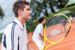 Men playing tennis