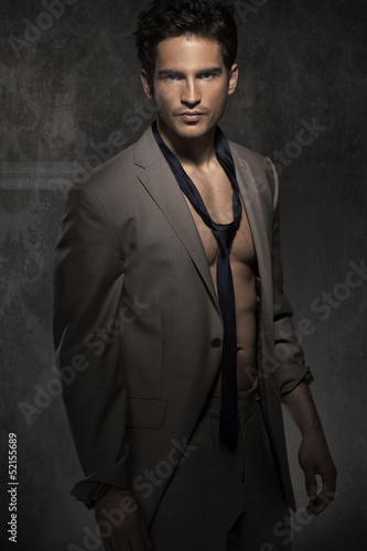 Photo: Serious smart man without shirt Serious smart man without shirt