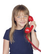 Adorable girl with a red phone