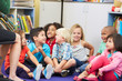 Photo: Group of Elementary Pupils In Classroom Listening To Teacher Group of Elementary Pupils In Classroom Listening To Teacher