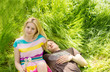 Attractive couple lying down on the grass