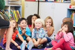 Group of Elementary Pupils In Classroom Touching Noses