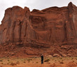 Man Taking a Photograph of the Rain God Mesa