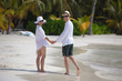happy young couple have fun on beach