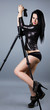 Sexy brunette leaning on tripod