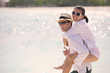 happy young couple have fun on beach