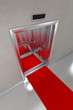 Illustration: Open elevator with red carpet in modern lobby Open elevator with red carpet in modern lobby