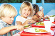 Photo: Elementary Pupils Enjoying Healthy Lunch In Cafeteria Elementary Pupils Enjoying Healthy Lunch In Cafeteria