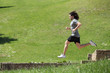 Sportsman running and jumping in a park