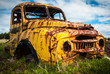 Yellow pickup truck rusty wreck