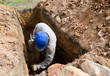 man digs grave